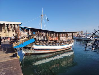 Boats moored at harbor