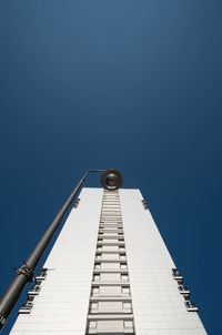 Low angle view of built structure against clear blue sky