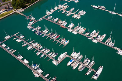 Yachts and boats in marina bay at phuket thailand aerial view