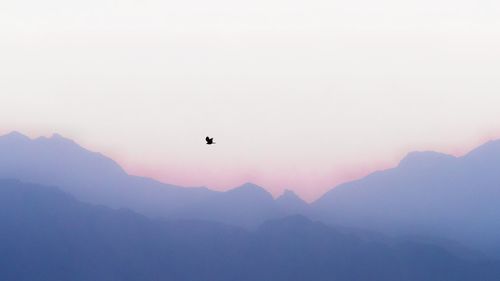 Scenic view of mountains against sky during sunset