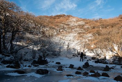 Scenic view of snow covered mountains against sky