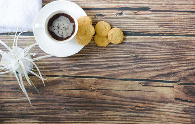 High angle view of coffee and leaves on table