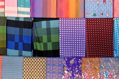 Full frame shot of multi colored scarves for sale at market stall