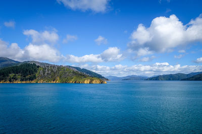 Scenic view of sea against blue sky