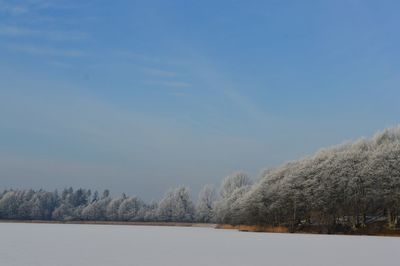 Scenic view of frozen landscape against clear sky