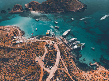 High angle view of rocks on sea shore