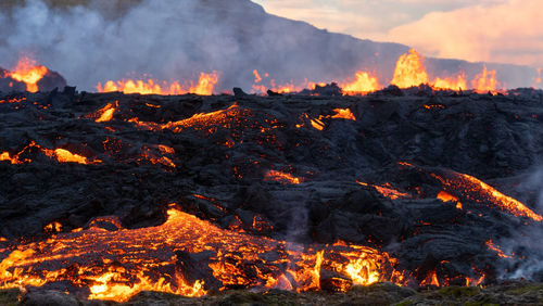 Molten lava flowing from an volcanic eruption in mt fagradalsfjall volcano, iceland, august 2022