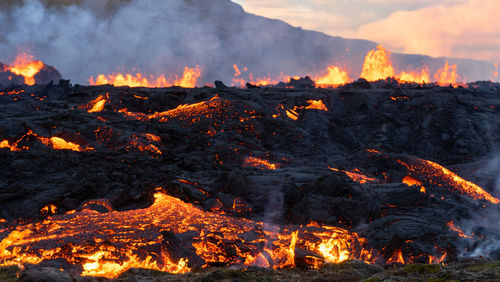 Burning on land during sunset