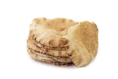 Close-up of bread against white background