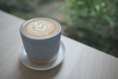 Close-up of cappuccino on table