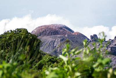 Scenic view of volcanic mountain against sky