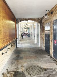 People in corridor of building