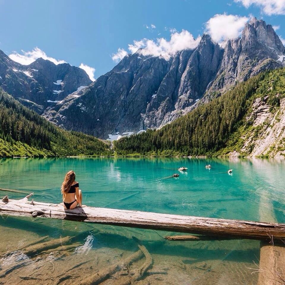 tranquil scene, water, mountain, tranquility, lake, tree, scenics, mountain range, beauty in nature, idyllic, nature, calm, solitude, non-urban scene, sky, snowcapped mountain, blue, majestic, remote, day, green color, outdoors, lakeside, rocky mountains, vacations