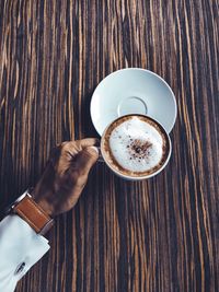 High angle view of coffee cup on table