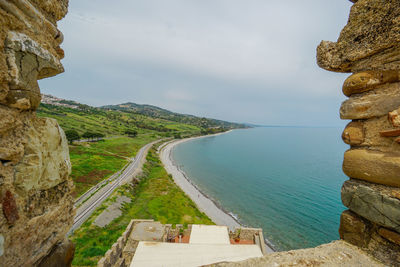 Panoramic view of sea and mountains against sky