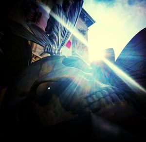 Low angle view of illuminated lamp against sky