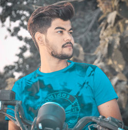 Portrait of young man looking away