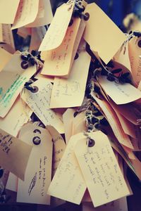 Full frame shot of papers hanging outdoors