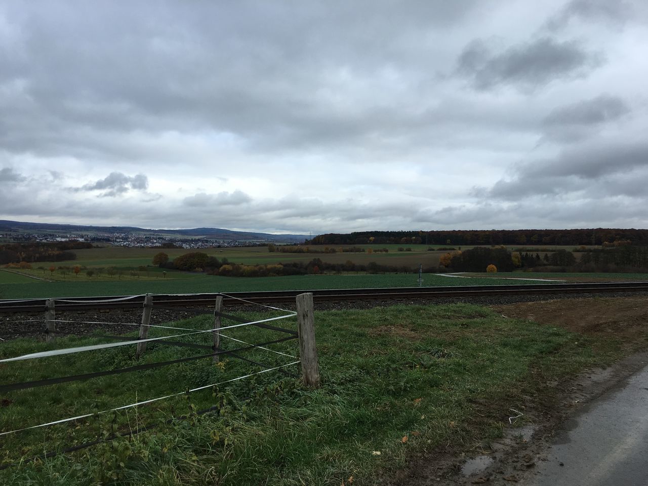 sky, field, cloud - sky, landscape, cloudy, grass, rural scene, agriculture, tranquil scene, tranquility, farm, scenics, nature, fence, cloud, beauty in nature, grassy, overcast, weather, growth