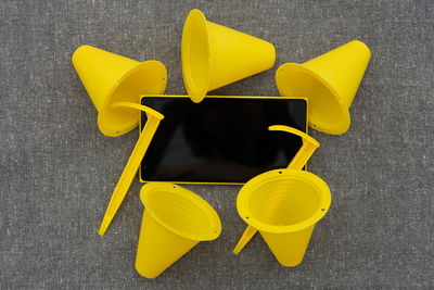 High angle view of yellow chair on table