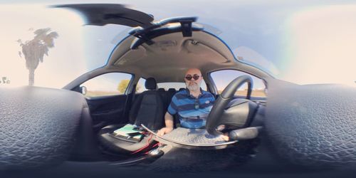 Man sitting in car