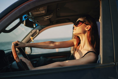 Woman sitting in car