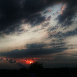 Scenic view of dramatic sky at sunset