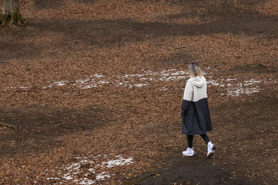 Full length of woman standing on field