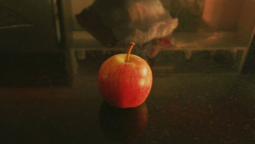 indoors, food and drink, close-up, focus on foreground, freshness, holding, orange color, healthy eating, fruit, illuminated, food, home interior, ball, night, red, celebration, glowing, childhood