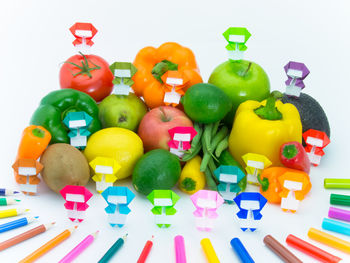 Close-up of colorful toys against white background