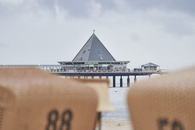 View of pier over sea against sky