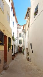 Narrow street amidst buildings in town