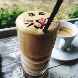 Close-up of cappuccino served on table