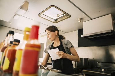 Female chef working in food truck