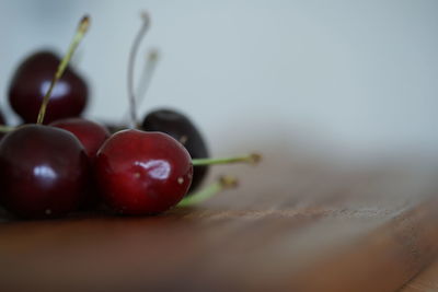 Close-up of cherries on table