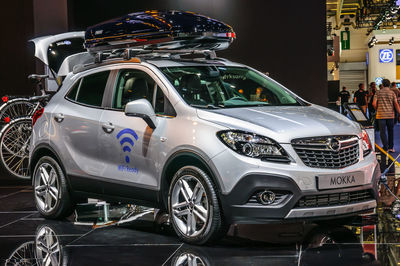 Cars parked on street in city at night