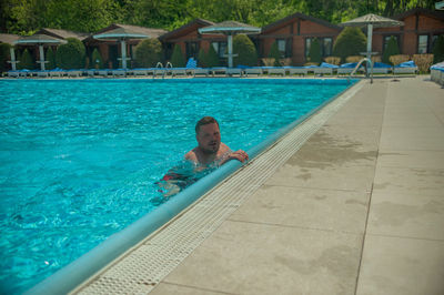 High angle view of man swimming in pool