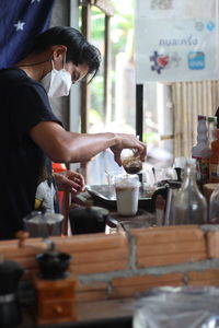 Man preparing food at table