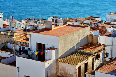 High angle view of houses by sea