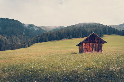 House on field against sky