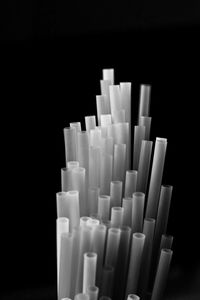 Close-up of stack against black background