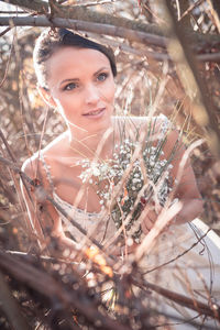 Portrait of young woman on field