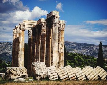 Exterior of temple against cloudy sky