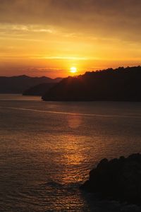 Scenic view of sunset over sea