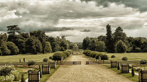 Trees growing against cloudy sky at wrest park