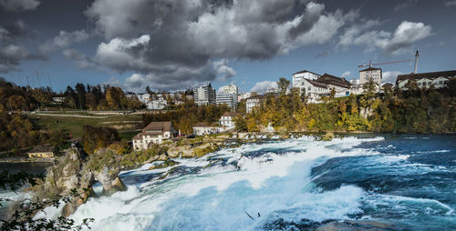 Panoramic view of river against cloudy sky