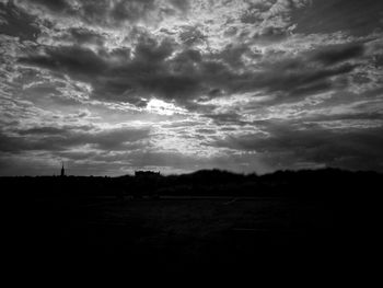 Scenic view of silhouette landscape against sky during sunset