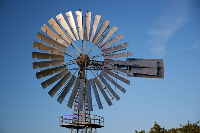 Low angle view of windmill against clear sky