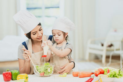 Midsection of woman preparing food on table