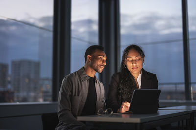 Business people working late in office